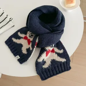 Detailed view of the navy blue knitted winter scarf showing the cute jacquard pattern and woven tag.