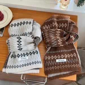 Cozy winter knit scarf featuring classic Fair Isle geometric pattern, soft and warm accessory detail.