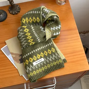 Cozy winter warm knitted scarf featuring traditional Fair Isle geometric patterns style.