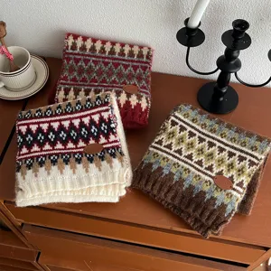 Cozy winter Fair Isle knit scarf detail shot, thick retro geometric pattern neck warmer.