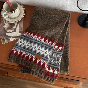 Detailed shot of retro brown Fair Isle knitted scarf featuring colorful geometric patterns.
