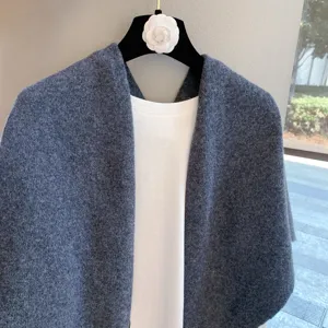 Dark grey wool shawl detail shot, elegant winter warm knitted cape scarf for women.