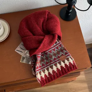 Detailed shot of retro Fair Isle knit scarf, thick warm winter red colorway snood.