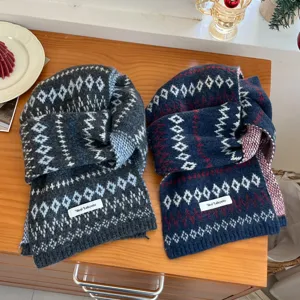 Detailed view of cozy winter Fair Isle knit scarves featuring geometric patterns and labels.