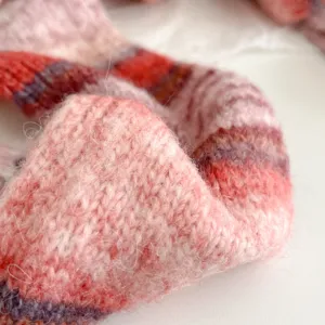 Cozy colorblock knit scarf detail shot, retro style soft wool-blend winter warm accessory.