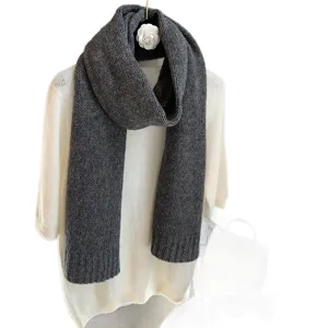Dark grey knitted winter scarf for women, solid color warm neck wrap, cozy fashion accessory.