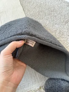 Dark grey wool balaclava hat with pom pom, warm 100% wool knit winter hood for women detail.