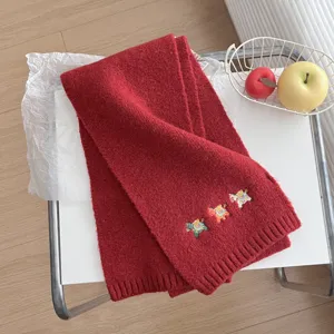 Cozy red knitted scarf for autumn and winter, featuring cute pony embroidery and warm soft material.