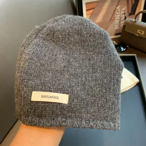 Grey 100% wool knitted beanie hat for women, warm winter thermal wool cap for cold weather daily wear.