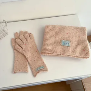 Cozy pink knit scarf and gloves set with colorful speckles, soft winter warm accessories.