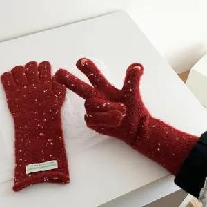 Red speckled knit gloves featuring a cozy half-finger design for winter daily warmth and style.