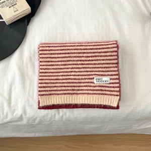 Cozy striped knitted scarf for women, soft warm winter neck wrap in classic casual style.