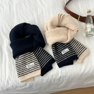 Women winter knitted striped scarf detail view, cozy warm thick wool neck warmer for cold days.
