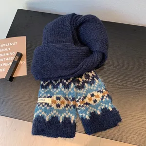 Fair Isle knitted scarf detail, cozy thick winter neck wrap with geometric jacquard pattern.