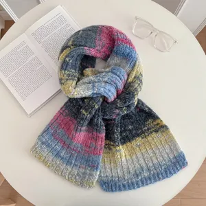 Detailed view of the retro gradient color knitted scarf, soft warm winter texture display.