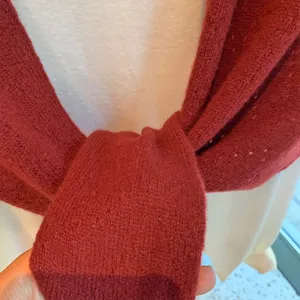 Red knit triangular scarf shawl winter warm fashion cozy neck wrap elegant clothing accessory.