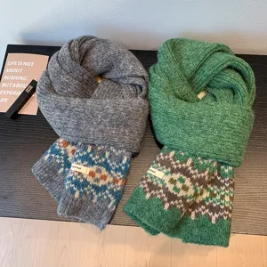 Cozy winter knitted scarf with classic Fair Isle pattern, thick warm shawl for women detail view.