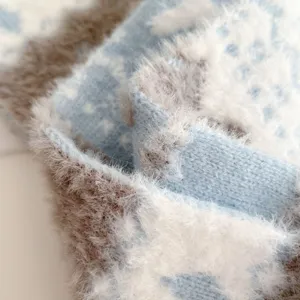 Cozy Fair Isle knit scarf detail shot, fluffy textured winter warm fashion accessory.