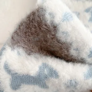 Soft fluffy knitted scarf fabric detail macro shot, cozy winter warmth texture close up