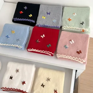 Cozy knit winter scarf featuring cute 3D butterfly embroidery and elegant scalloped edge design.