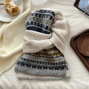 Cozy Fair Isle knitted scarf for women, warm winter neck warmer with stylish geometric pattern.