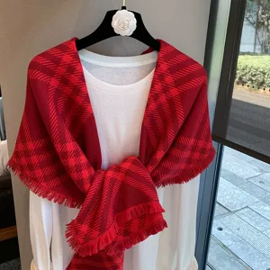 Classic red plaid scarf with fringe, stylish winter warm shawl and cozy apparel accessory.