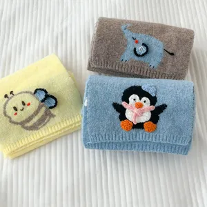 Cute cartoon animal knitted cross scarf detail view, soft warm winter short muffler.