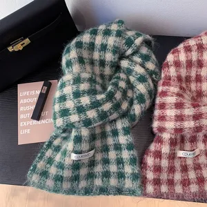 Detailed view of winter retro plaid knitted scarf, soft cozy wool material, warm fashion shawl.