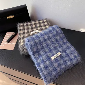 Cozy fuzzy plaid winter scarf for women, stylish warm thick oversized checkered neck wrap.