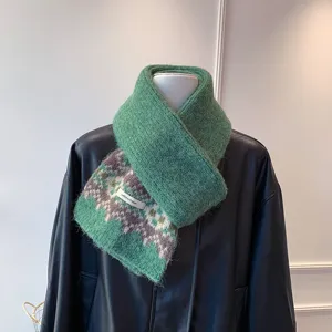 Fair Isle knitted winter scarf detail, cozy thick green warm winter fashion accessory