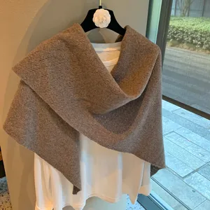 Brown knitted hollow triangular scarf shawl and white t-shirt layered set for women fashion.
