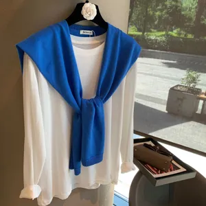 Korean minimalist white long sleeve t-shirt with blue knit shawl set for stylish daily wear.