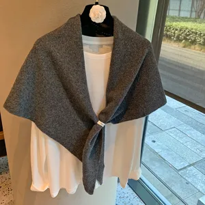 Grey hollow knit triangle scarf and shawl, elegant solid color fashion outdoor winter accessory.