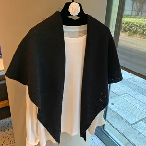 Black hollow knit triangle shawl, versatile solid color scarf for women urban fashion style.