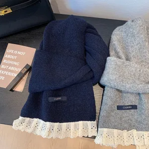 Detailed view of sweet lace trim knit winter scarf in navy and grey, cozy unisex warm accessory.