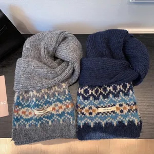 Close-up detail of cozy knit Fair Isle winter scarf showing soft thick texture and pattern.