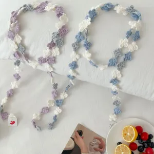 Detailed view of handmade crochet flower lace trim, colorful DIY garment accessories and decor.