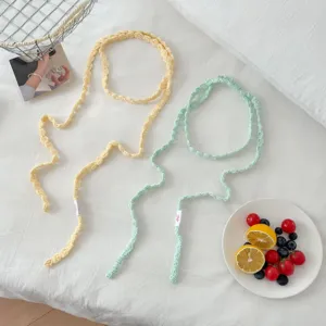 Handmade crochet floral skinny scarf neck chain for women, unique aesthetic knitwear.