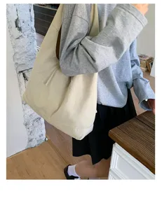 Casual large canvas shoulder bag, minimalist daily tote for women, soft slouchy design.