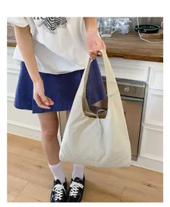 Casual beige canvas tote bag for women, large capacity shoulder bag for daily commute.