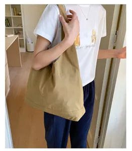 Khaki canvas shoulder tote bag detail shot, large casual everyday bag for women style.