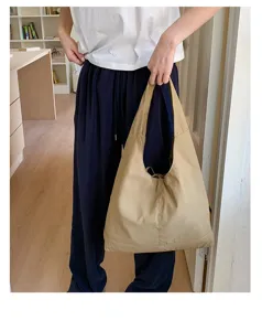 Casual khaki shoulder bag detail, large capacity tote for daily commute and stylish shopping trips.