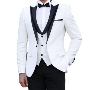 Detailed view of the elegant white tuxedo suit jacket and black vest combination.