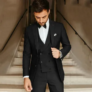 Detailed view of men's business slim fit 3-piece suit, classic black blazer and trousers.