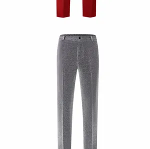 Detailed close-up view of grey shiny silk men's suit trousers texture and waist design.