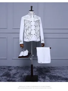 White stage suit detail featuring silver sequin tassels and embroidery for performers.