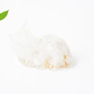 Close-up view of clear crystal resin cat figurine, beautiful desk decor detail showing texture.