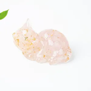 Crystal resin cat figurine detail view, beautiful pink quartz stone desk decor ornament.