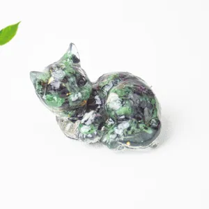 Close up detail of handmade crystal stone epoxy resin cute cat figurine for home decor use.