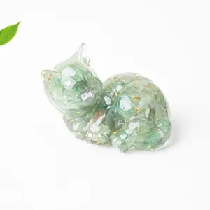 Close-up detail of the handmade crystal resin cat figurine, showing clear texture.
